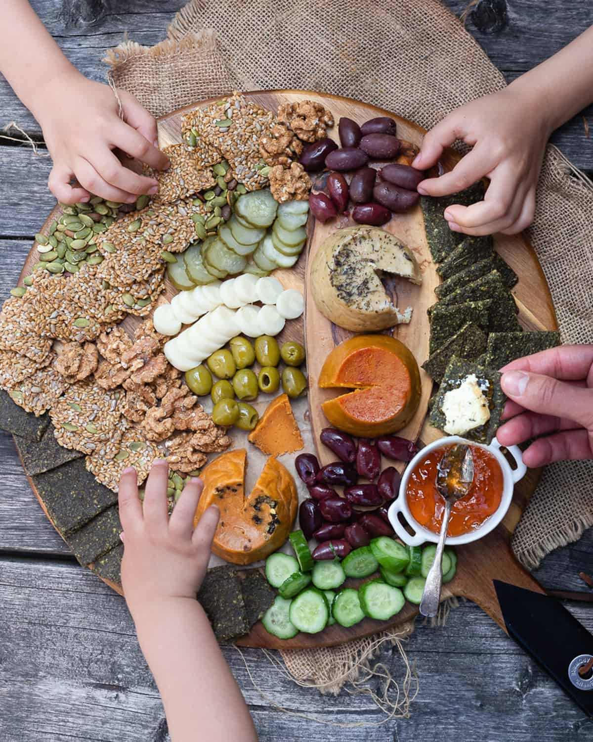 Image of a wooden cutting board full of snacks showcasing a snack option for picky eater