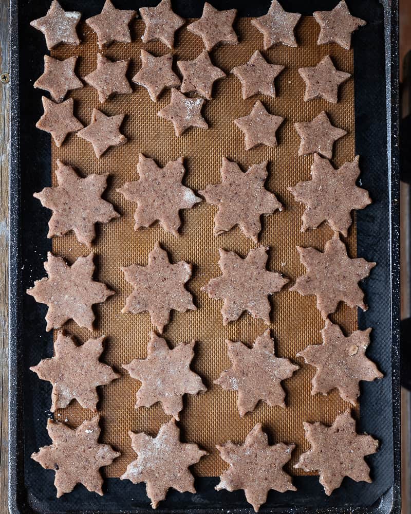 Cookie stars on a baking sheet ready to be baked