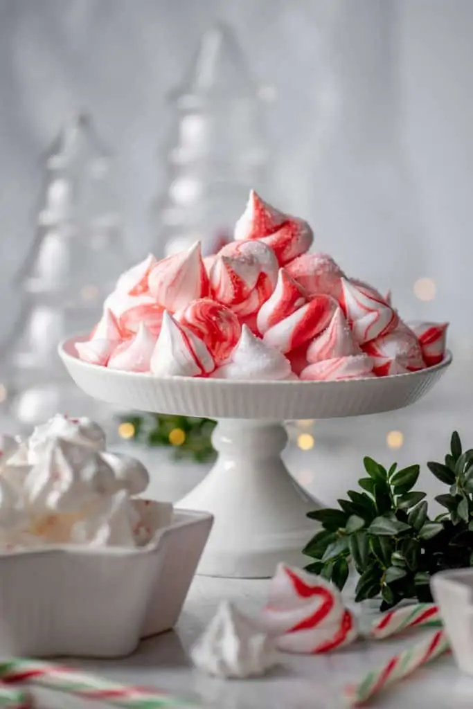 Vegan Peppermint meringues on a white cake holder