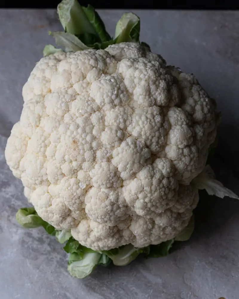 head of cauliflower washed and ready to be chopped