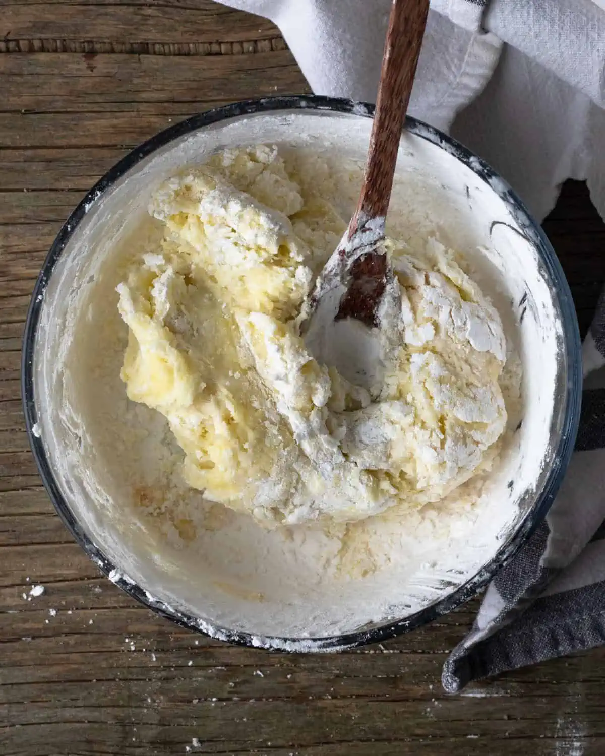 Image of tapioca dough sittig in a glass bowl. the image is for recipe post on how to make these Brazilian snacks.