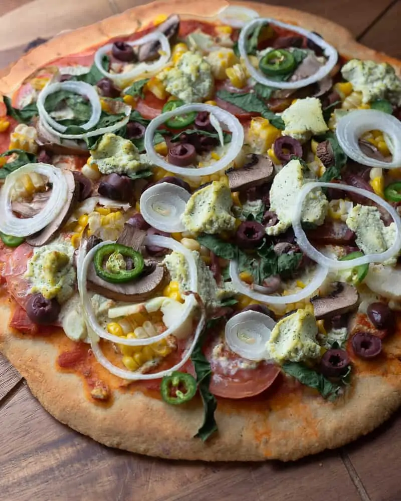 Image of a glutenf ree pizza with fresh veggies