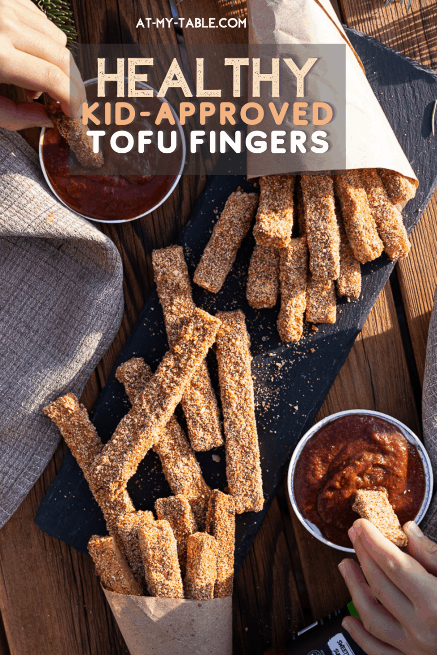 Birds eye view of tofu fingers being dipped in ketchup. Easy gluten free recipe for a healthy vegan recipe