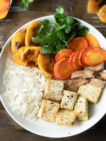 Image of a well balanced vegan meal to show what a balanced plate should look like for a post on how to create healthy recipes.