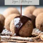 Pinterest pin for a reciep post on easy date balls recipe. The image is a close up of a energy bites sitting on a wire rack being drizzled with chocolate syrup.