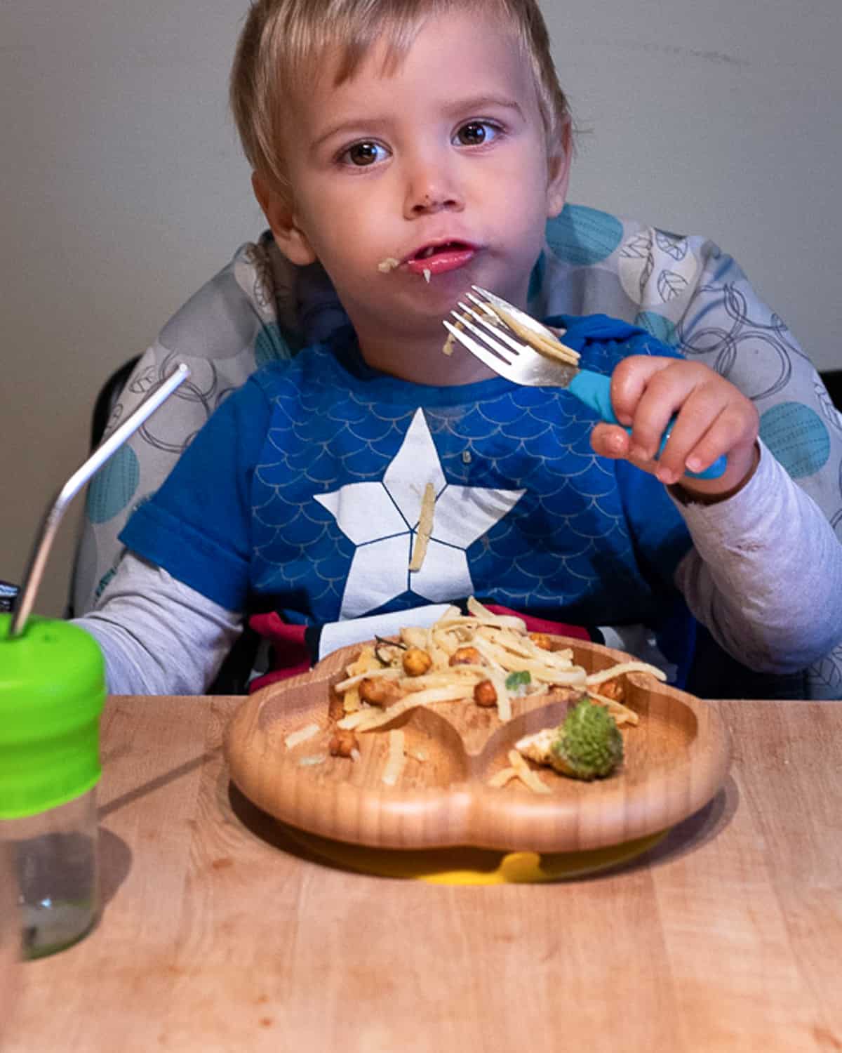 Image of a 12 month old eating a vegan meal.