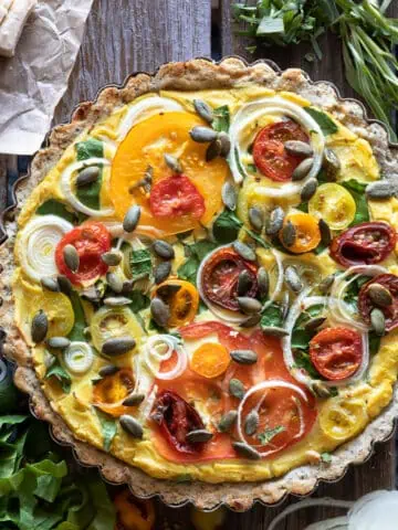 Image of a vegan and gluten free quiche for a how to recipe post using tofu and almond flour to make this egg-less recipe.