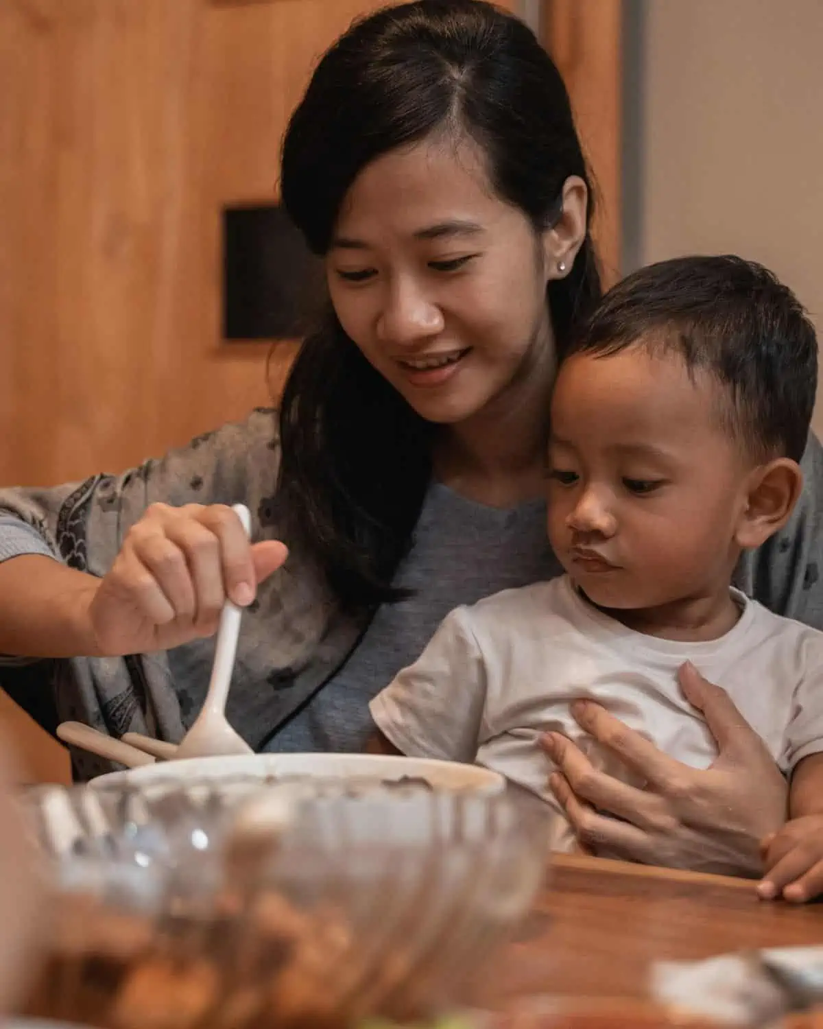 Mother and child enjoying a meal together. image is for a recipe post on tips and meal ideas for picky eaters.