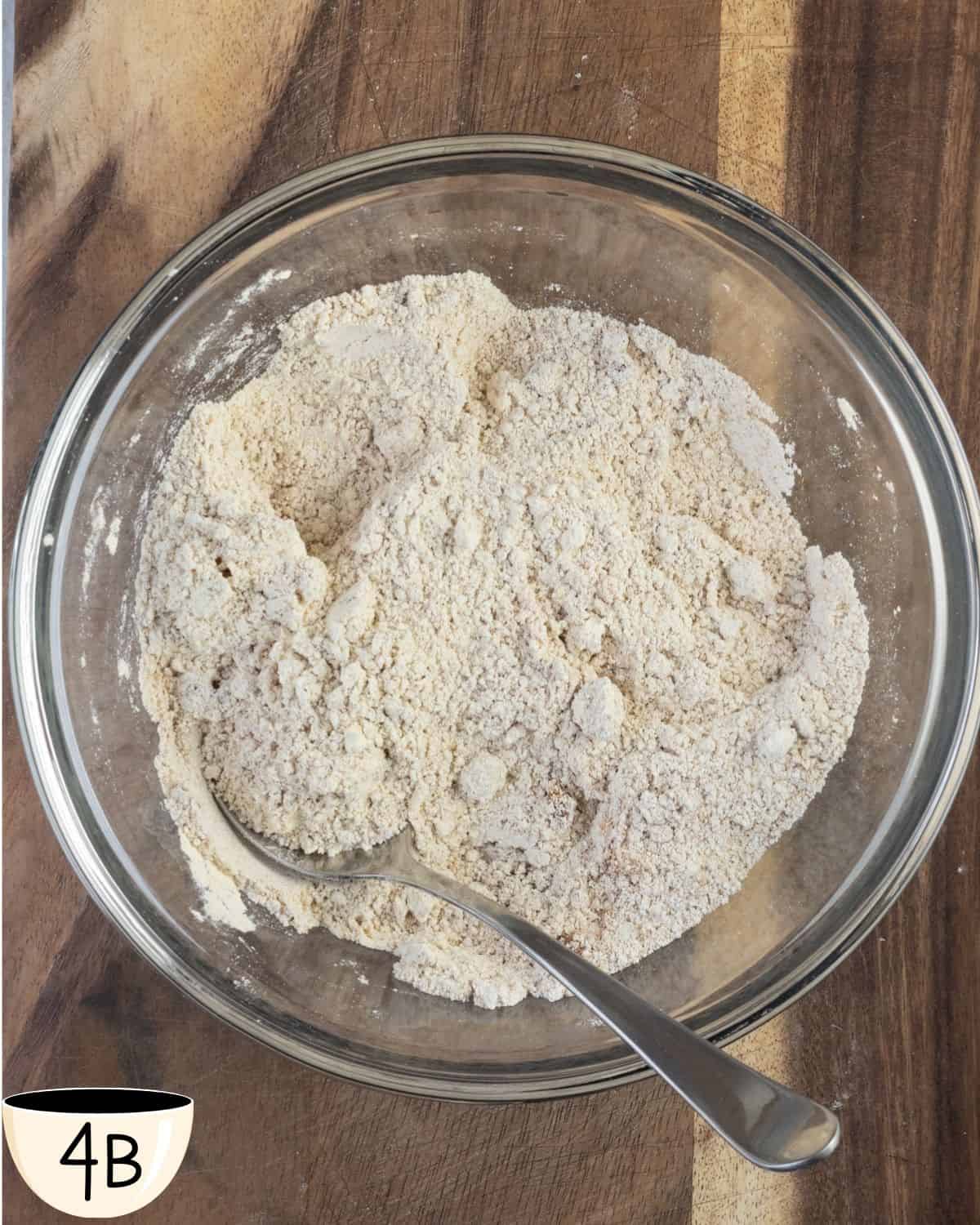 A mixture of dry and wet ingredients in a bowl, showing the first stage of combining them for muffin batter.