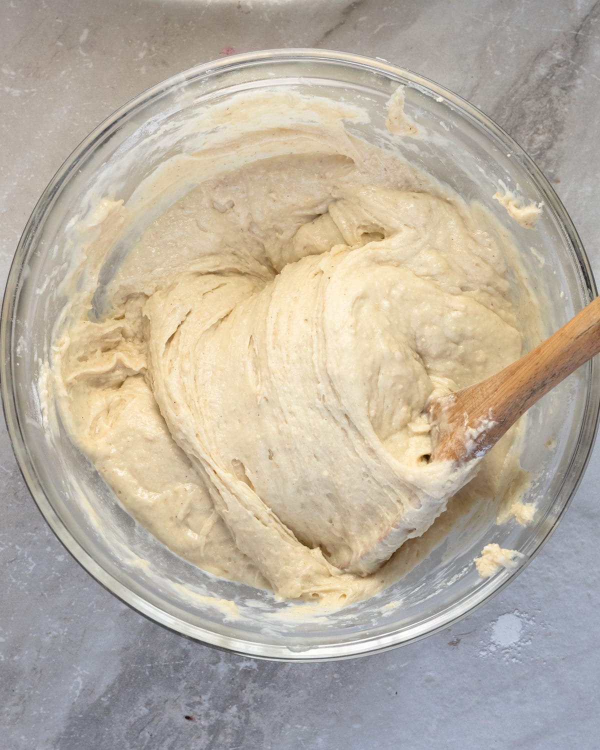 Gluten-free muffin batter fully mixed and rested to show the consistency of the batter and what it shoudl look like to make a fluffy muffin.