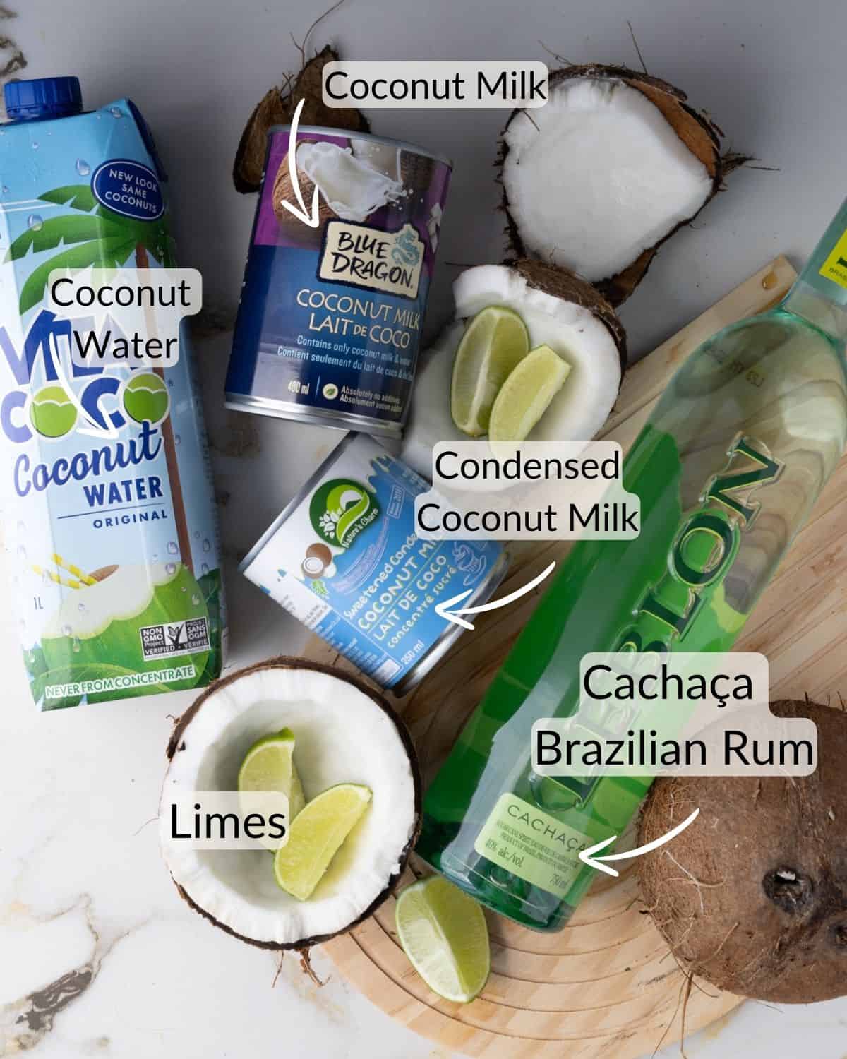 ngredients for batida de coco, including coconut milk, coconut water, condensed coconut milk, cachaça (Brazilian rum), and limes.